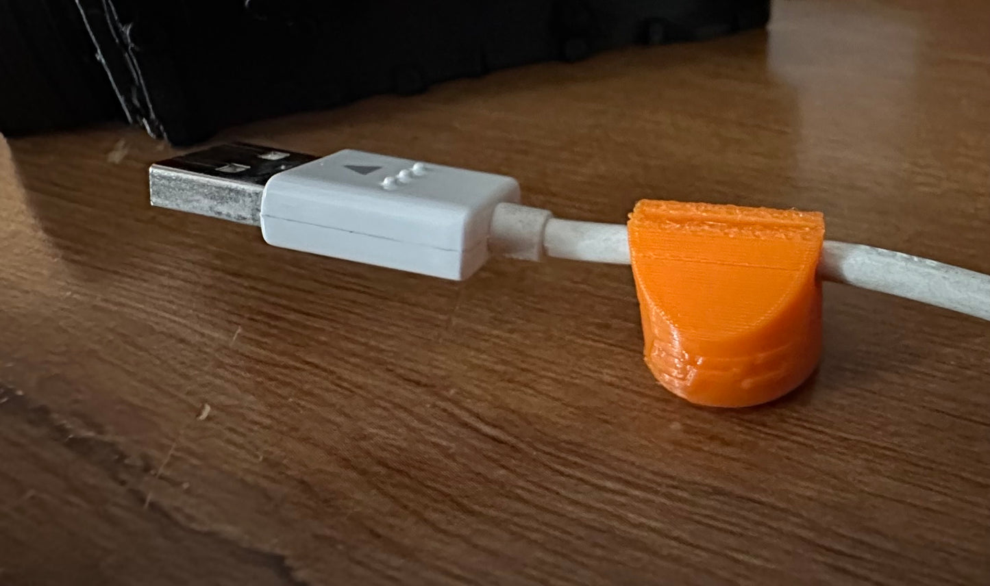 Magnetic USB cable clip